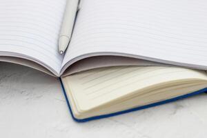 The pen lies in the notebook, the concept of study, time management. photo