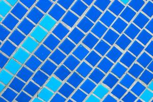 Texture of blue mosaic tiles, close-up photo