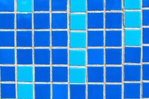 Texture of blue mosaic tiles, close-up photo