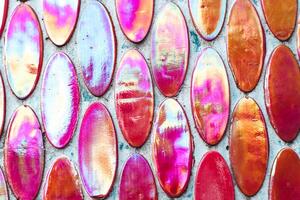 Texture of mother-of-pearl mosaic round tiles, close-up photo