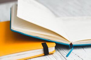 Notebook diary for planning in blue and yellow. photo