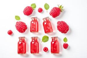 Raspberry Jam Bottles With Fresh Raspberries and Green Leaves photo
