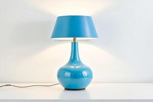 Blue Table Lamp with White Shade on a White Table photo