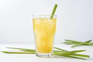 Refreshing Pineapple Juice with Ice and a Green Straw photo