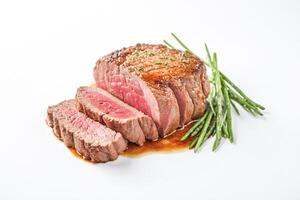 Closeup of Sliced Steak with Asparagus and Sauce photo
