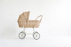 Wicker Baby Carriage On White Background photo