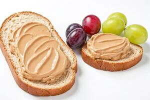 Peanut Butter Spread on Bread Slices with Grapes photo
