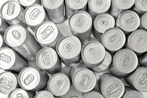 Close-up of multiple silver cans with pull-tabs photo