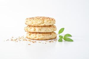 Stack of coconut cookies with basil leaves photo