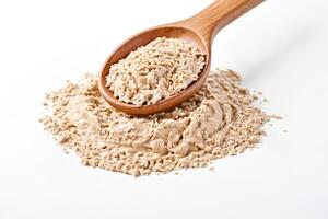 Fresh Yeast in a Wooden Spoon on a White Background photo