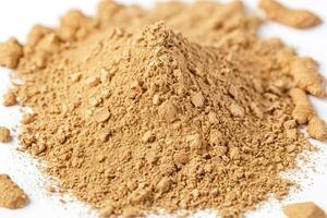 Crushed Ginger Powder on White Background photo