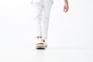 Casual Stride White Pants and Sneakers on the Move photo