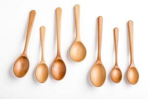 Wooden Spoons of Different Sizes on White Background photo