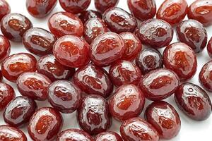 Close up of shiny red dates on white background photo