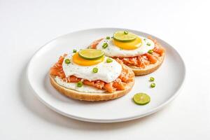 Smoked Salmon and Fried Egg on Toast with Lime photo
