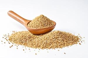 Pile of Coriander Seeds with Wooden Spoon photo