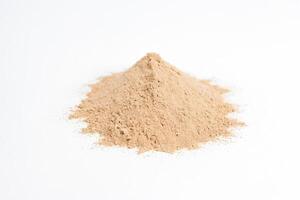Heap of Light Brown Powder on White Background photo