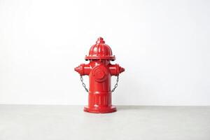 Red fire hydrant on a white background photo