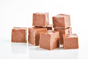 Stack of Chocolate Fudge Cubes on a White Background photo