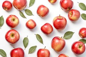 Red Apples with Green Leaves on White Background photo