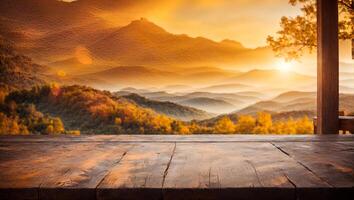 Wooden Tabletop with a Mountain View at Sunset photo
