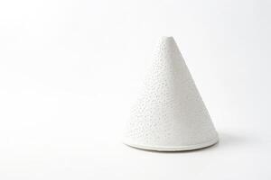 White Cone Shaped Object with a Textured Surface photo