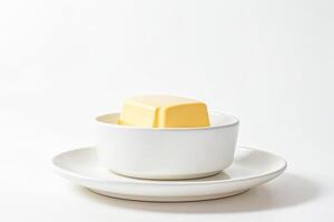 A Single Cube of Butter in a White Bowl photo
