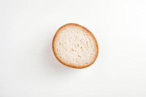 Close-up of a Single Round Bun with Crispy Crust photo