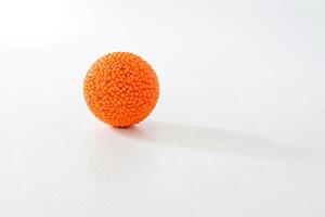 Orange Sphere on White Background photo
