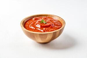 Bowl of Tomato Sauce with Parsley Garnish photo
