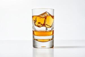 Glass of whiskey with ice cubes on a white background photo