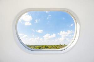 Round Window with a View of the Sky and Forest photo