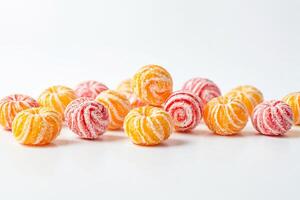 Orange and red hard candies isolated on white background photo