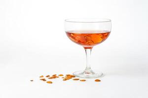 Glass of Wine with Autumn Leaves on a White Background photo
