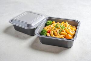 Pasta with Vegetables in a Takeout Container photo