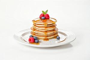 Delicious Stack of Pancakes Drizzled with Maple Syrup and Topped with Fresh Berries photo