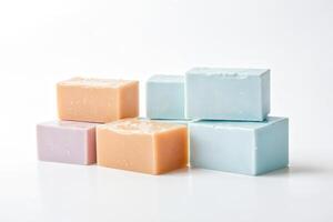 Stack of colorful handmade soap bars on white background photo