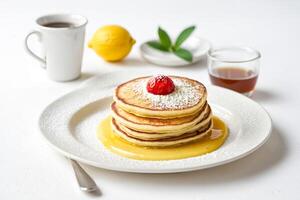 Closeup of a stack of pancakes with syrup and a cherry on top photo