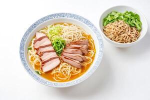 Bowl of Pork Noodle Soup with Garnish photo