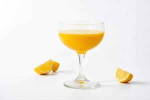 Glass of orange juice with lemon slices on a white background photo