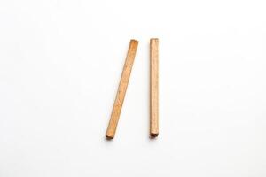 Two Cinnamon Sticks on White Background photo
