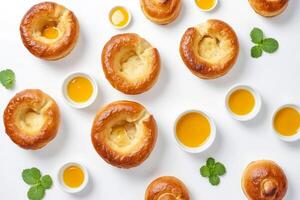 Close Up of Delicious Golden Bread Rolls with Butter photo