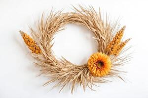 Dried Grass and Flower Wreath on White Background photo