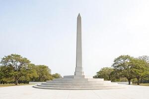 Monument in a grassy field photo