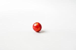 Single red apple on a white background photo