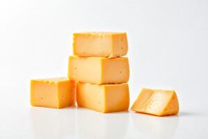 Stack of Cheese Blocks with a Single Slice photo