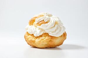 Freshly baked cream puff with whipped cream on top photo