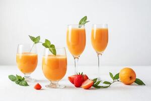 Fresh Orange Juice with Strawberries and Apricots photo