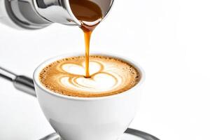 Close up of pouring coffee into a cup with latte art photo