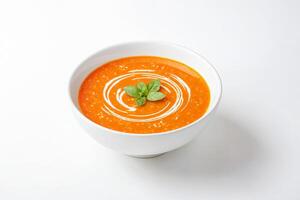 Delicious Tomato Soup with a Swirl of Cream and Basil Garnish photo